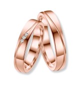 Anell d’aliança per dona en titani IP rosa 14k amb zirconites incrustades, acabat brillant i disseny modern