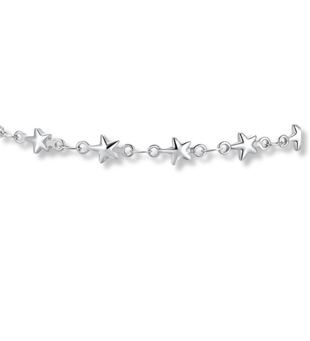 Tobillera de acero inoxidable con estrellas brillantes y diseño minimalista para mujer.